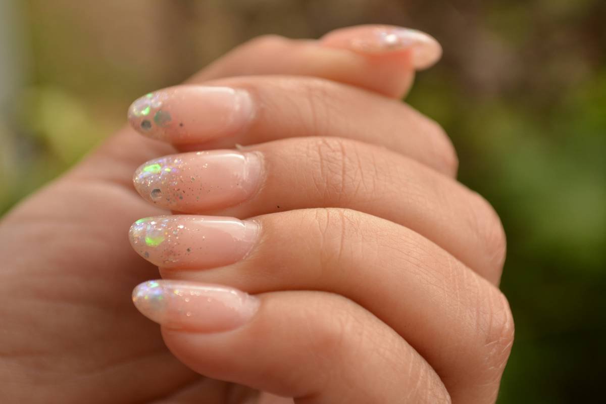 Side-by-side comparison showing brittle nails before and after using nail care elixir for 21 days